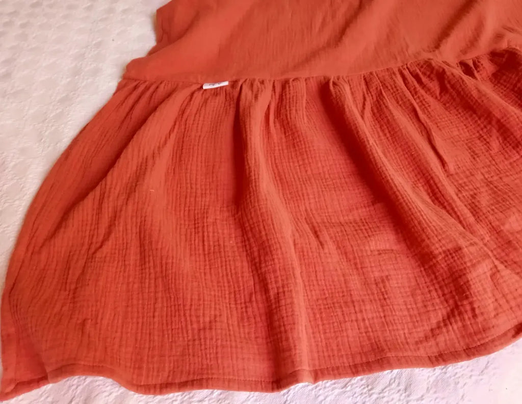 pie de cama manta volados color ladrillo terracota naranja muselina dormitorio sofa